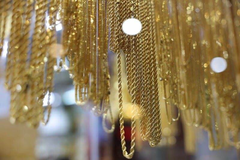 Gold holds steady as weak US jobs data cools Fed rate-hike bets